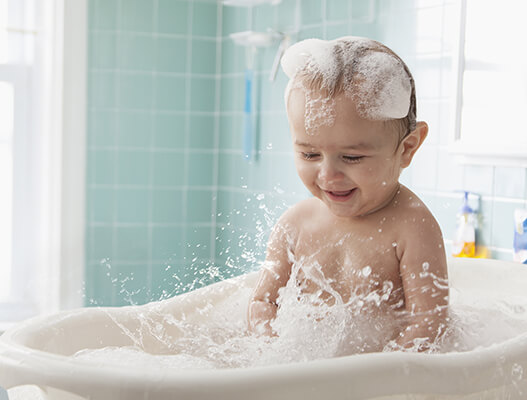 Baby having fun at bath time